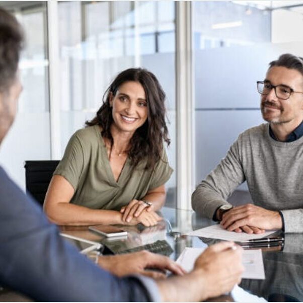 Client sitting with advisor and happy at the conversation